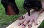 Mistress crushes slave's hand with heels