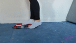 Toy train destroyed with sock feet