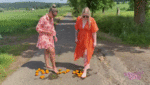 Sexy women crush oranges bare feet
